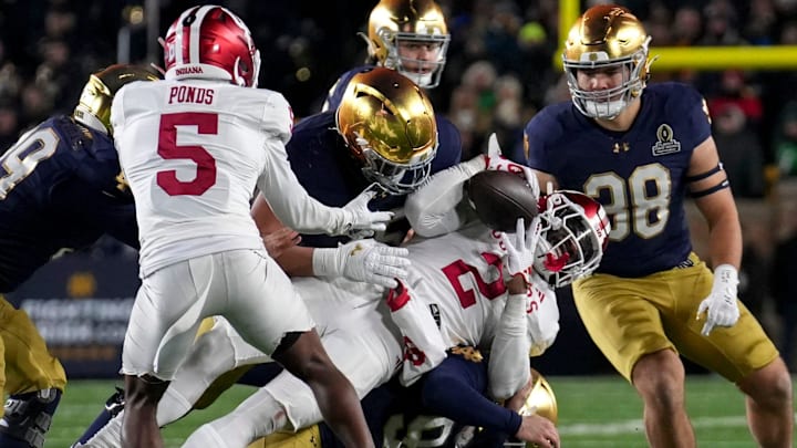 Indiana Hoosiers linebacker Jailin Walker (2) recovers a missed field goal during the second half of a game between the Indiana Hoosiers and the Notre Dame Fighting Irish in first round of the College Football Playoff on Friday, Dec. 20, 2024, in South Bend. Notre Dame defeated Indiana 27-17.
