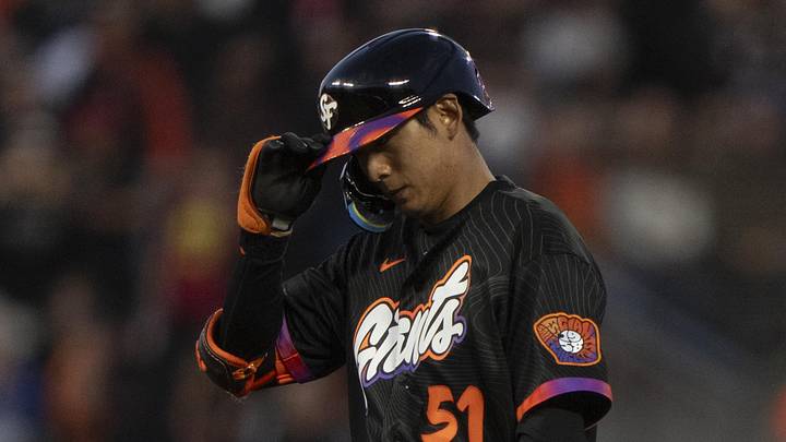 Jun 9, 2026; San Francisco, California, USA;  San Francisco Giants right fielder Jung Hoo Lee (51) adjusts his helmet during the fifth inning against the Washington Nationals at Oracle Park. Mandatory Credit: Stan Szeto-Imagn Images