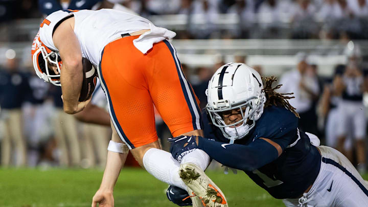 Penn State's Jaylen Reed tackles Illinois quarterback Luke Altmyer in the fourth quarter of a Big Ten football game, Saturday, Sept. 28, 2024, in State College, Pa.