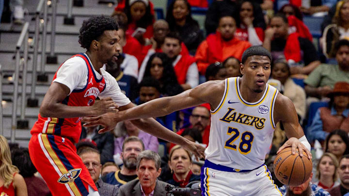 Nov 14, 2025; New Orleans, Louisiana, USA;  Los Angeles Lakers forward Rui Hachimura (28) dribbles against New Orleans Pelicans forward Herbert Jones (2) during the second half at Smoothie King Center. Mandatory Credit: Stephen Lew-Imagn Images