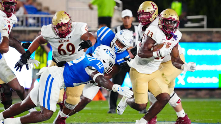 Aug 30, 2024; Durham, North Carolina, USA;  Elon Phoenix running back Rushawn Baker (23) run with the ball against Duke Blue Devils during the first half at Wallace Wade Stadium.  