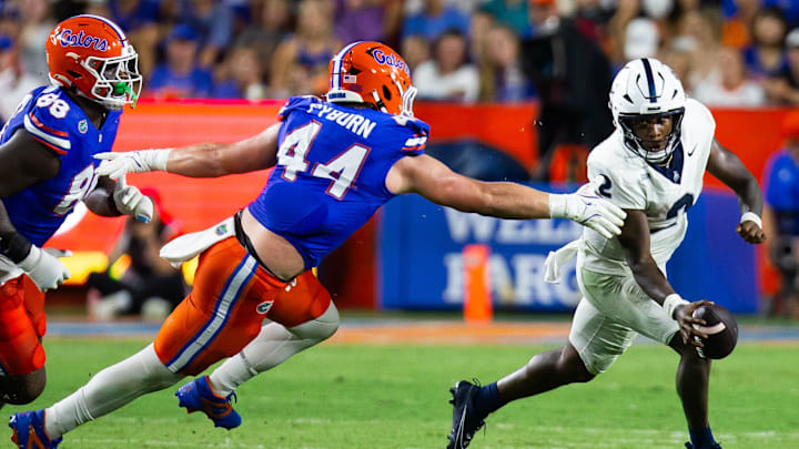 Florida Gators edge Jack Pyburn (44) chases down Samford Bulldogs quarterback Quincy Crittendon (2) during the first half at Ben Hill Griffin Stadium in Gainesville, FL on Saturday, September 7, 2024 against the Samford Bulldogs. The Gators lead 14-0 at the half. [Doug Engle/Gainesville Sun]