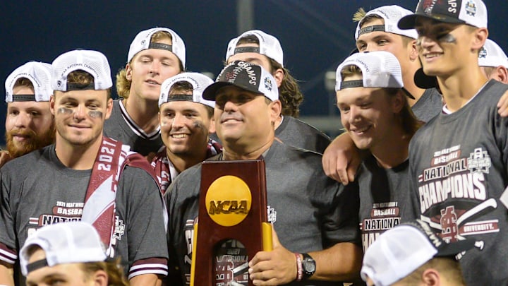 Mississippi State Bulldogs head coach Chris Lemonis raises the national championship trophy with his team after the win against the Vanderbilt Commodores at TD Ameritrade Park. Mississippi State Bulldogs head coach Chris Lemonis raises the national championship trophy with his team after the win against the Vanderbilt Commodores at TD Ameritrade Park.