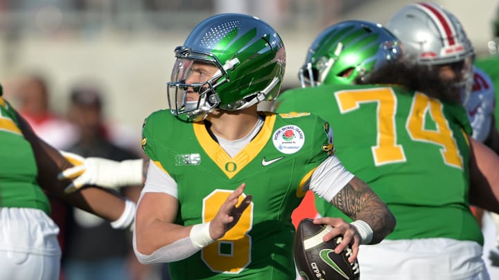 Jan 1, 2025; Pasadena, CA, USA; Oregon Ducks quarterback Dillon Gabriel (8) throws a pass in the first half against the Ohio State Buckeyes in the 2025 Rose Bowl college football quarterfinal game at Rose Bowl Stadium. Mandatory Credit: Jayne Kamin-Oncea-Imagn Images