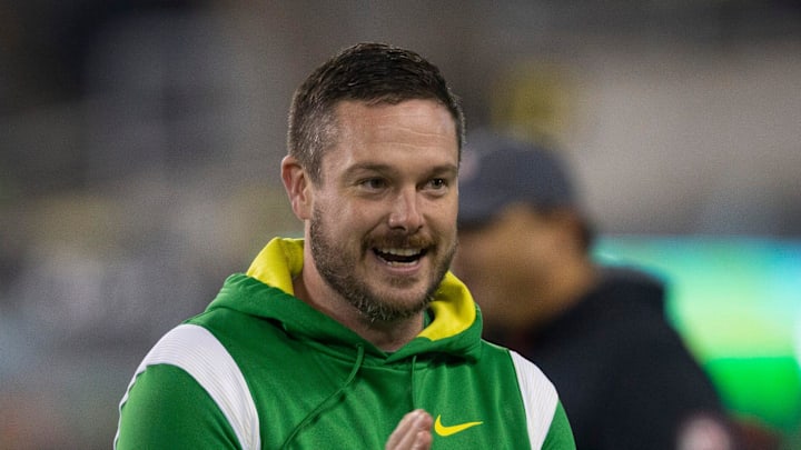 Oregon coach Dan Lanning joins his team during warmups before their game against Utah in final home game of season at Autzen Stadium.

Ncaa Football Oregon Utah Football Utah At Oregon