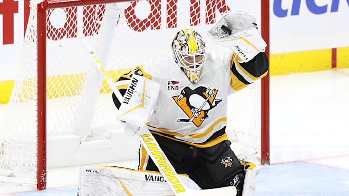 Oct 20, 2024; Winnipeg, Manitoba, CAN; Pittsburgh Penguins goaltender Alex Nedeljkovic (39) makes a glove save in the third period against the Winnipeg Jets at Canada Life Centre. Mandatory Credit: James Carey Lauder-Imagn Images