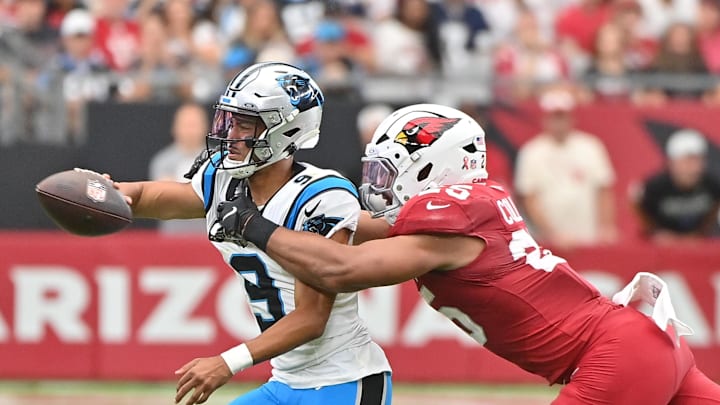 Sep 14, 2025; Glendale, Arizona, USA; Arizona Cardinals linebacker Baron Browning (5) reaches for Carolina Panthers quarterback Bryce Young (9) during the first quarter at State Farm Stadium. Mandatory Credit: Matt Kartozian-Imagn Images Sep 14, 2025; Glendale, Arizona, USA; Arizona Cardinals linebacker Baron Browning (5) reaches for Carolina Panthers quarterback Bryce Young (9) during the first quarter at State Farm Stadium. Mandatory Credit: Matt Kartozian-Imagn Images