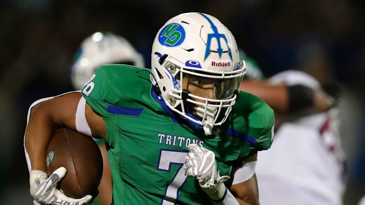 Green Bay Notre Dame's Kingston Allen (7) runs the ball in for a touchdown during a football game against De Pere High School on Aug. 29, 2025, in Green Bay, Wis. Green Bay Notre Dame defeated De Pere 42-30.