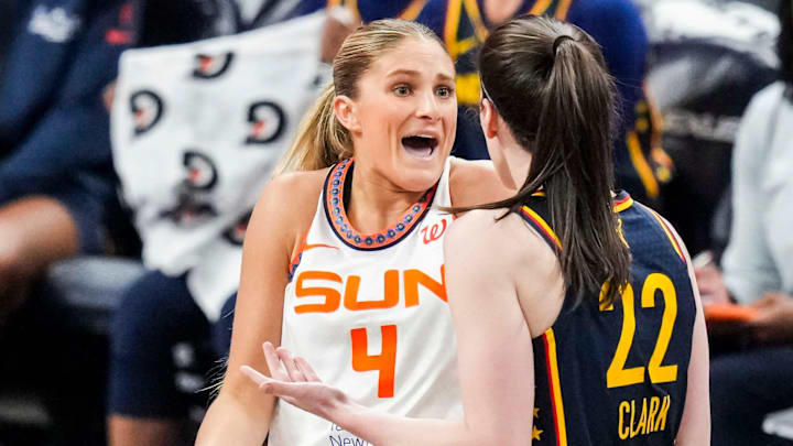 Connecticut Sun guard Jacy Sheldon (4) and Indiana Fever guard Caitlin Clark (22) express frustration with each other Tuesday, June 17, 2025, during a game between the Indiana Fever and the Connecticut Sun at Gainbridge Fieldhouse in Indianapolis.