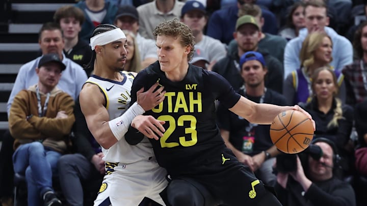 Jan 15, 2024; Salt Lake City, Utah, USA; Utah Jazz forward Lauri Markkanen (23) dribbles against Indiana Pacers guard Andrew Nembhard (2) during the first quarter at Delta Center. Mandatory Credit: Rob Gray-Imagn Images