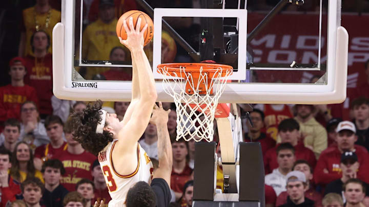 Feb 28, 2026; Ames, Iowa, USA; Iowa State Cyclones forward Blake Buchanan (23) dunks over Texas Tech Red Raiders forward Josiah Moseley (5) during the second half at James H. Hilton Coliseum. Mandatory Credit: Reese Strickland-Imagn Images