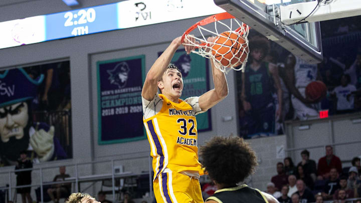 Cooper Flagg of Montverde Academy dunks during their semifinal game against Paul VI at the City of