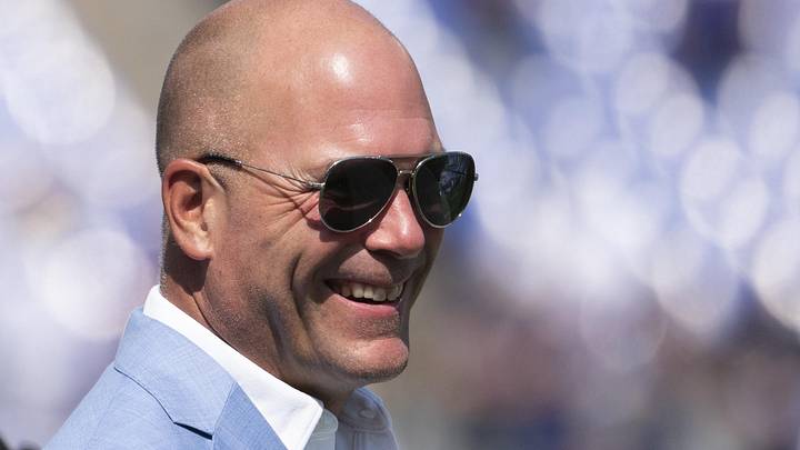 Sep 15, 2024; Baltimore, Maryland, USA;  Baltimore Ravens general manager Eric DeCosta walks across the the field before the game against the Las Vegas Raiders at M&T Bank Stadium. Mandatory Credit: Tommy Gilligan-Imagn Images
