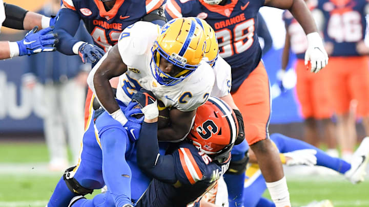 Nov 11, 2023; New York, New York, USA; Syracuse Orange linebacker Derek McDonald (15) tackles Pittsburgh Panthers running back C'Bo Flemister (24) during the first half at Yankee Stadium. Mandatory Credit: Dennis Schneidler-Imagn Images Nov 11, 2023; New York, New York, USA; Syracuse Orange linebacker Derek McDonald (15) tackles Pittsburgh Panthers running back C'Bo Flemister (24) during the first half at Yankee Stadium. Mandatory Credit: Dennis Schneidler-Imagn Images