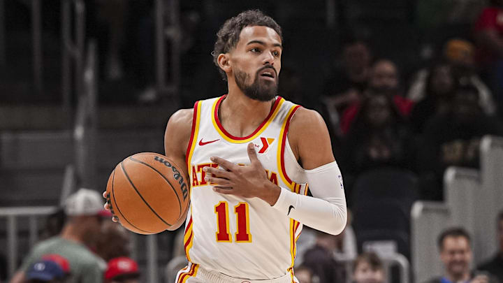 Nov 9, 2024; Atlanta, Georgia, USA; Atlanta Hawks guard Trae Young (11) brings the ball up the court against the Chicago Bulls during the first half at State Farm Arena. Mandatory Credit: Dale Zanine-Imagn Images