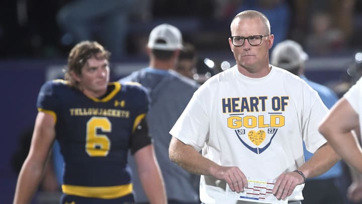 Stephenville football coach Sterling Doty walks with Camden McKinney (6) after the team shook hands with China Spring following the Yellow Jackets' 31-28 victory on Thursday, Oct. 19, 2023, at Tarleton Memorial Stadium in Stephenville.
