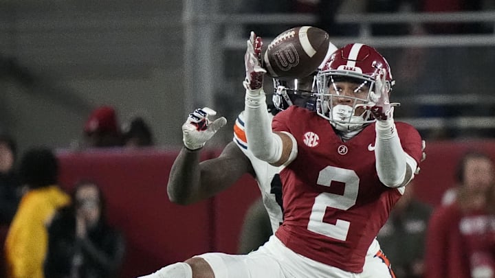 Nov 30, 2024; Tuscaloosa, Alabama, USA;  Alabama Crimson Tide defensive back Zabien Brown (2) intercepts a pass intended for Auburn Tigers tight end Rivaldo Fairweather (13) during second half at Bryant-Denny Stadium. Alabama won 28-14. 