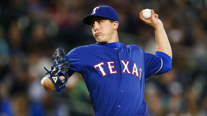 Sep 8, 2016; Seattle, WA, USA; Texas Rangers starting pitcher Derek Holland (45) throws against the Seattle Mariners during the second inning at Safeco Field. Mandatory Credit: Joe Nicholson-USA TODAY Sports