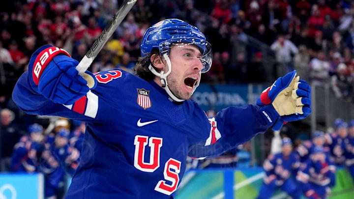 Feb 18, 2026; Milan, Italy; Quinn Hughes (43) of the United States celebrates his winning goal in overtime against Sweden in a men's ice hockey quarterfinal during the Milano Cortina 2026 Olympic Winter Games at Milano Santagiulia Ice Hockey Arena. Mandatory Credit: Amber Searls-Imagn Images