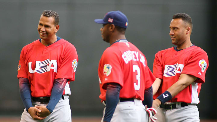 Alex Rodriguez warms up with shortstop (right) Derek Jeter and outfielder (center) Ken Griffey Jr. during practice at Chase Field in 2006.