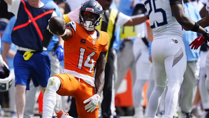 Sep 7, 2025; Denver, Colorado, USA; Denver Broncos wide receiver Courtland Sutton (14) reacts after a play against the Tennessee Titans in the first half at Empower Field at Mile High. Mandatory Credit: Ron Chenoy-Imagn Images
