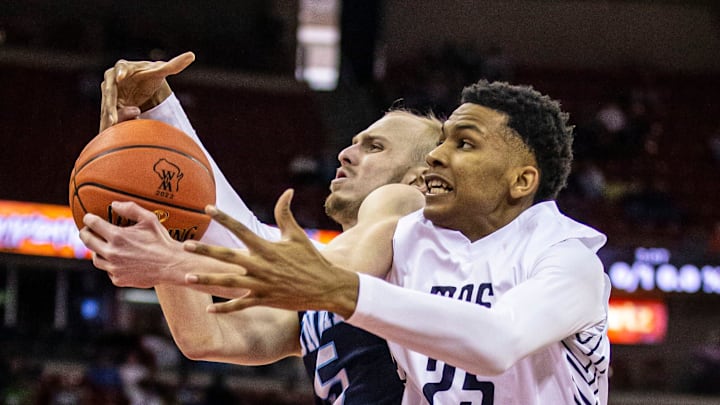Milwaukee Academy of Science's Davion Hannah (25) battles for a rebound with Roncalli's Luke Pautz (5) during the WIAA Division 4 state boys basketball championship at the Kohl Center in Madison on Saturday, March 19, 2022.

Mjs Bball State Semifinal 3008
