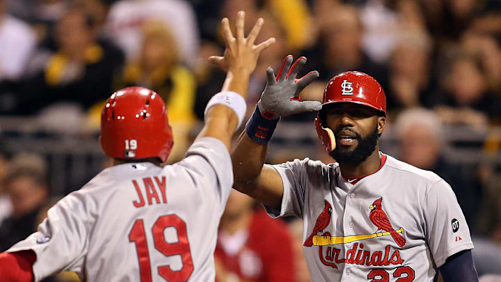 St. Louis Cardinals right fielder Jason Heyward (22) greets center fielder Jon Jay (19) as Jay scores a run against the Pittsburgh Pirates during the seventh inning at PNC Park in 2015. St. Louis Cardinals right fielder Jason Heyward (22) greets center fielder Jon Jay (19) as Jay scores a run against the Pittsburgh Pirates during the seventh inning at PNC Park in 2015.