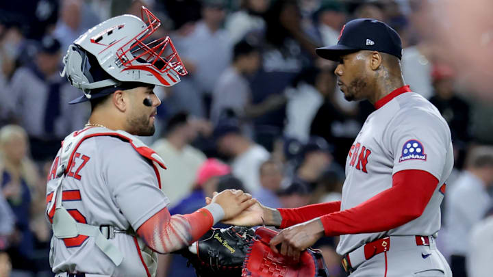 Sep 30, 2025; Bronx, New York, USA; Boston Red Sox catcher Carlos Narvaez (75) and relief pitcher Aroldis Chapman (44) celebrate after defeating the New York Yankees in game one of the Wildcard round of the 2025 MLB playoffs at Yankee Stadium. Mandatory Credit: Brad Penner-Imagn Images