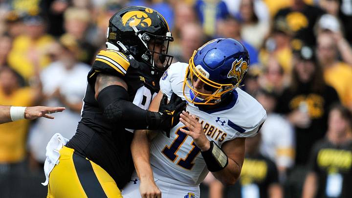 Sep 3, 2022; Iowa City, Iowa, USA; Iowa Hawkeyes defensive lineman Noah Shannon (99) shoves South Dakota State Jackrabbits quarterback Mark Gronowski (11) during the first quarter at Kinnick Stadium. Mandatory Credit: Jeffrey Becker-Imagn Images