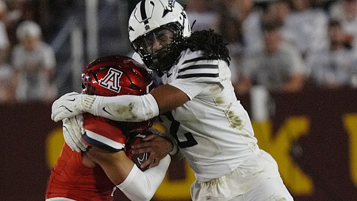 Arizona Wildcats quarterback Noah Fifita (1) gets tackle by Iowa State Cyclones' defensive back Jamison Patton (2) as running with ball for a first down during the second quarter in the Big-12 conference showdown on Sept. 27, 2025, at Jack Trice Stadium in Ames, Iowa.