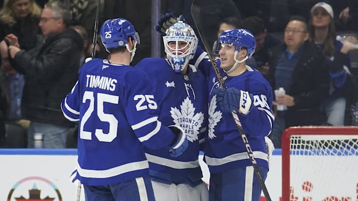 Nov 20, 2024; Toronto, Ontario, CAN; Toronto Maple Leafs defenseman Conor Timmins (25) and forward Alex Steeves congratulate goaltender Joseph Woll (60) on his shutout against the Vegas Golden Knights at Scotiabank Arena. Mandatory Credit: John E. Sokolowski-Imagn Images