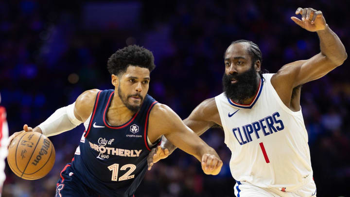 Mar 27, 2024; Philadelphia, Pennsylvania, USA; Philadelphia 76ers forward Tobias Harris (12) dribbles the ball against LA Clippers guard James Harden (1) during the second quarter at Wells Fargo Center. Mandatory Credit: Bill Streicher-USA TODAY Sports