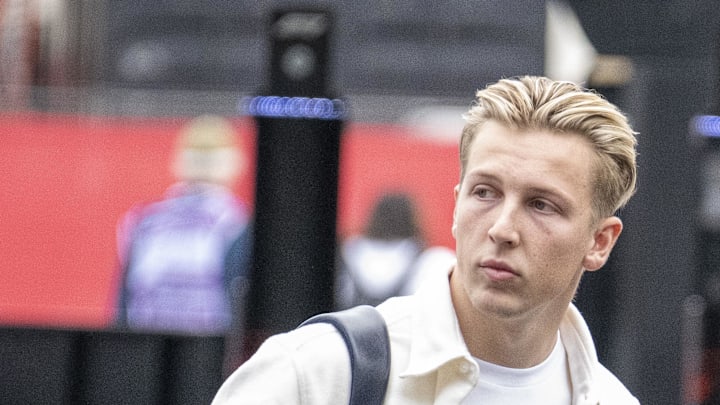 Oct 18, 2024; Austin, Texas, USA; Visa Cash App RB Formula One Team driver Liam Lawson (30) of Team New Zealand walks through the track entrance before practice for the 2024 US Grand Prix at Circuit of the Americas. Mandatory Credit: Jerome Miron-Imagn Images