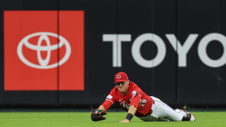 May 8, 2024; Cincinnati, Ohio, USA; Cincinnati Reds outfielder TJ Friedl (29) attempts to catch a fly out hit by Arizona Diamondbacks catcher Gabriel Moreno (not pictured) in the third inning at Great American Ball Park. Mandatory Credit: Katie Stratman-USA TODAY Sports