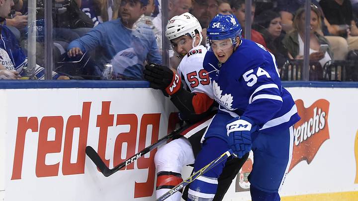 Sep 19, 2017; Toronto, Ontario, CAN; Toronto Maple Leafs defenceman Justin Holl (54) knocks Ottawa Senators forward Alex formenton (59) off the the puck in the first period at Air Canada Centre. Mandatory Credit: Dan Hamilton-USA TODAY Sports Sep 19, 2017; Toronto, Ontario, CAN; Toronto Maple Leafs defenceman Justin Holl (54) knocks Ottawa Senators forward Alex formenton (59) off the the puck in the first period at Air Canada Centre. Mandatory Credit: Dan Hamilton-USA TODAY Sports