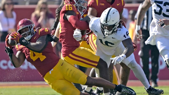 Oct 12, 2024; Los Angeles, California, USA; USC Trojans linebacker Easton Mascarenas-Arnold (4) intercepts a pass intended for Penn State Nittany Lions tight end Khalil Dinkins (16) at United Airlines Field at Los Angeles Memorial Coliseum. Mandatory Credit: Jayne Kamin-Oncea-Imagn Images
