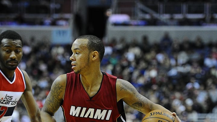 Mar 6, 2015; Washington, DC, USA; Miami Heat guard Shabazz Napier (13) dribbles the ball against the Washington Wizards during the second half at Verizon Center. Mandatory Credit: Brad Mills-Imagn Images