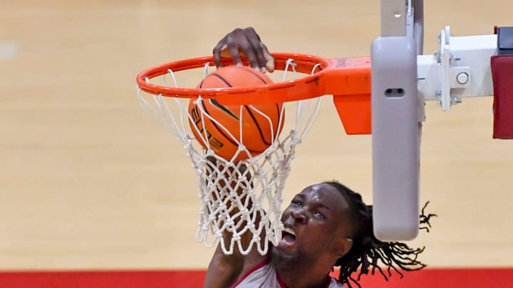 The University of Alabama men’s basketball teams works out in practice Thursday, Sept. 26, 2024. Alabama center Clifford Omoruyi (11) dunks the ball over Alabama forward Aiden Sherrell (22).