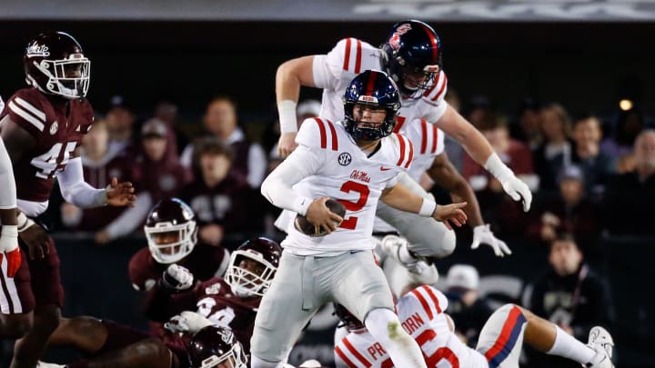 Nov 23, 2023; Starkville, Mississippi, USA; Mississippi Rebels quarterback Jaxson Dart (2) runs the ball during the second half against the Mississippi State Bulldogs at Davis Wade Stadium at Scott Field. Mandatory Credit: Petre Thomas-USA TODAY Sports