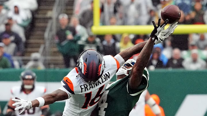 Sep 29, 2024; East Rutherford, New Jersey, USA; New York Jets cornerback D.J. Reed (4) defends against Denver Broncos wide receiver Troy Franklin (16) during the second half at MetLife Stadium. Mandatory Credit: Robert Deutsch-Imagn Images Sep 29, 2024; East Rutherford, New Jersey, USA; New York Jets cornerback D.J. Reed (4) defends against Denver Broncos wide receiver Troy Franklin (16) during the second half at MetLife Stadium. Mandatory Credit: Robert Deutsch-Imagn Images