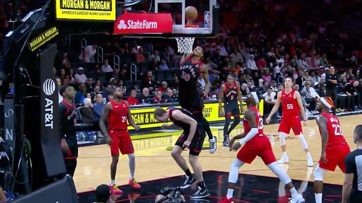 Ochai Agbaji throws it down on teammate Jakob Poeltl. 