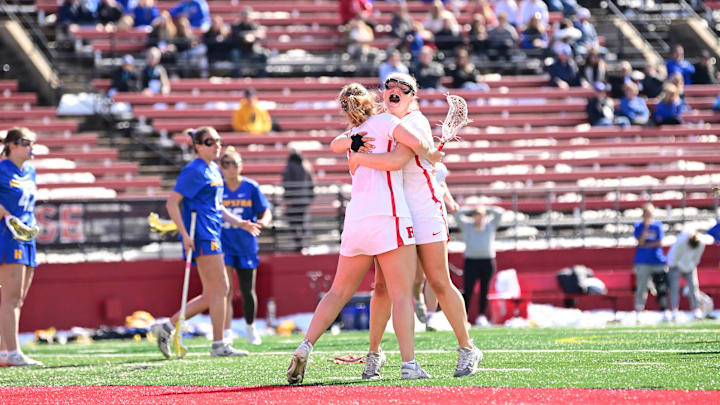 The Rutgers Women's Lacrosse team celebrates a goal against Hofstra. The Rutgers Women's Lacrosse team celebrates a goal against Hofstra.