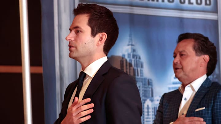 Detroit Tigers president Scott Harris joins others in saying the Pledge of Allegiance