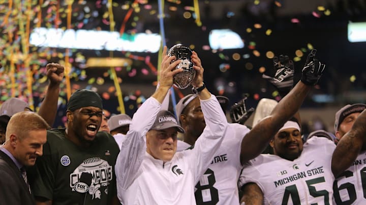 Michigan State coach Mark Dantonio raises the Big Ten championship trophy after the 16-13 win against Iowa on Saturday, Dece. 5, 2015 at Lucas Oil Stadium in Indianapolis.

Img Celebrate Msu 120515 1