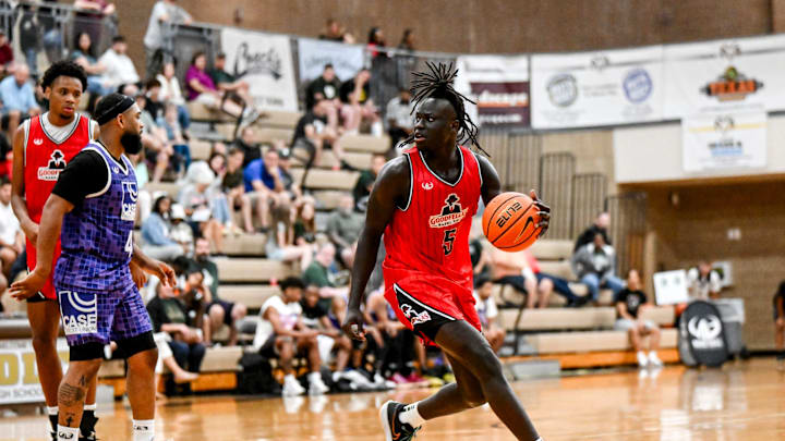 Michigan State freshman and Team Goodfellas' Kur Teng, moves the ball against Team Case Credit Union in the game on Tuesday, June 25, 2024, during the Moneyball Pro-Am at Holt High School.