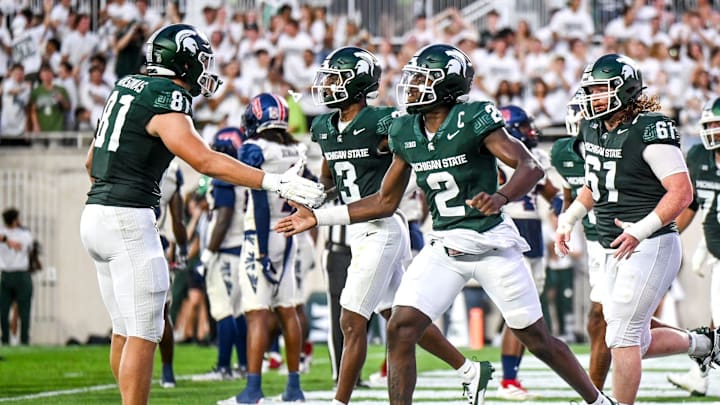Michigan State's Aidan Chiles, right, celebrates his touchdown with Michael Masunas during the second quarter in the game against Florida Atlantic on Friday, Aug. 30, 2024, at Spartan Stadium in East Lansing.