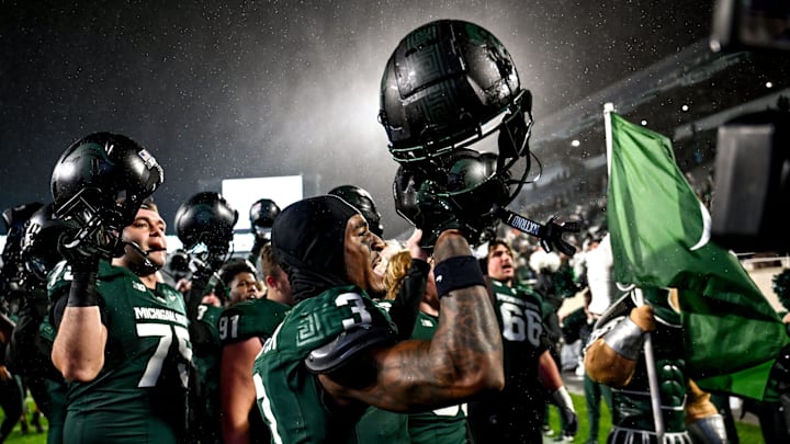 Michigan State's Montorie Foster Jr., center, and the team celebrate after defeating Purdue on Friday, Nov. 22, 2024, at Spartan Stadium in East Lansing.