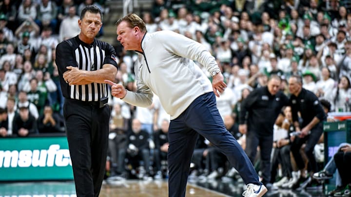 Illinois' head coach Brad Underwood, right, yells at a referee during the first half in the game against Michigan State on Sunday, Jan. 19, 2025, at the Breslin Center in East Lansing.
