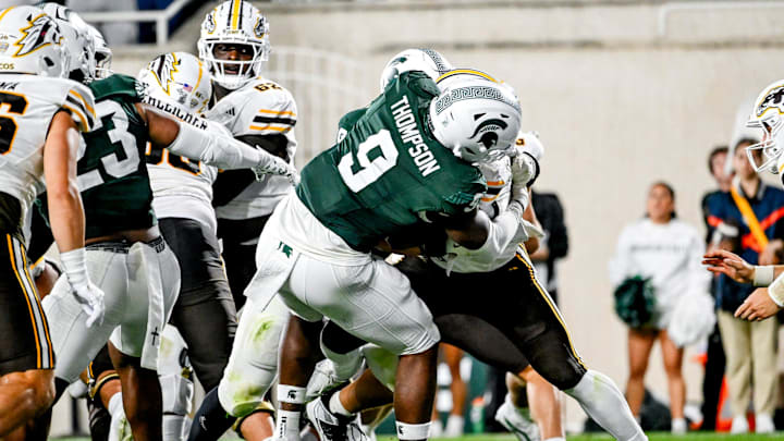 Michigan State's Jalen Thompson, left, tackles Western Michigan's Jalen Buckley for a safety during the third quarter on Friday, Aug. 29, 2025, in East Lansing.