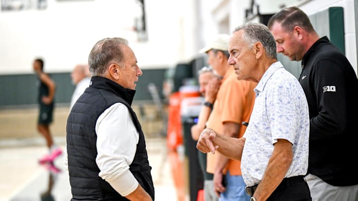 Michigan State's coach Tom Izzo, left, talks with former football head coach Mark Dantonio during the first day of basketball practice on Monday, Sept. 22, 2025, at the Breslin Center in East Lansing.